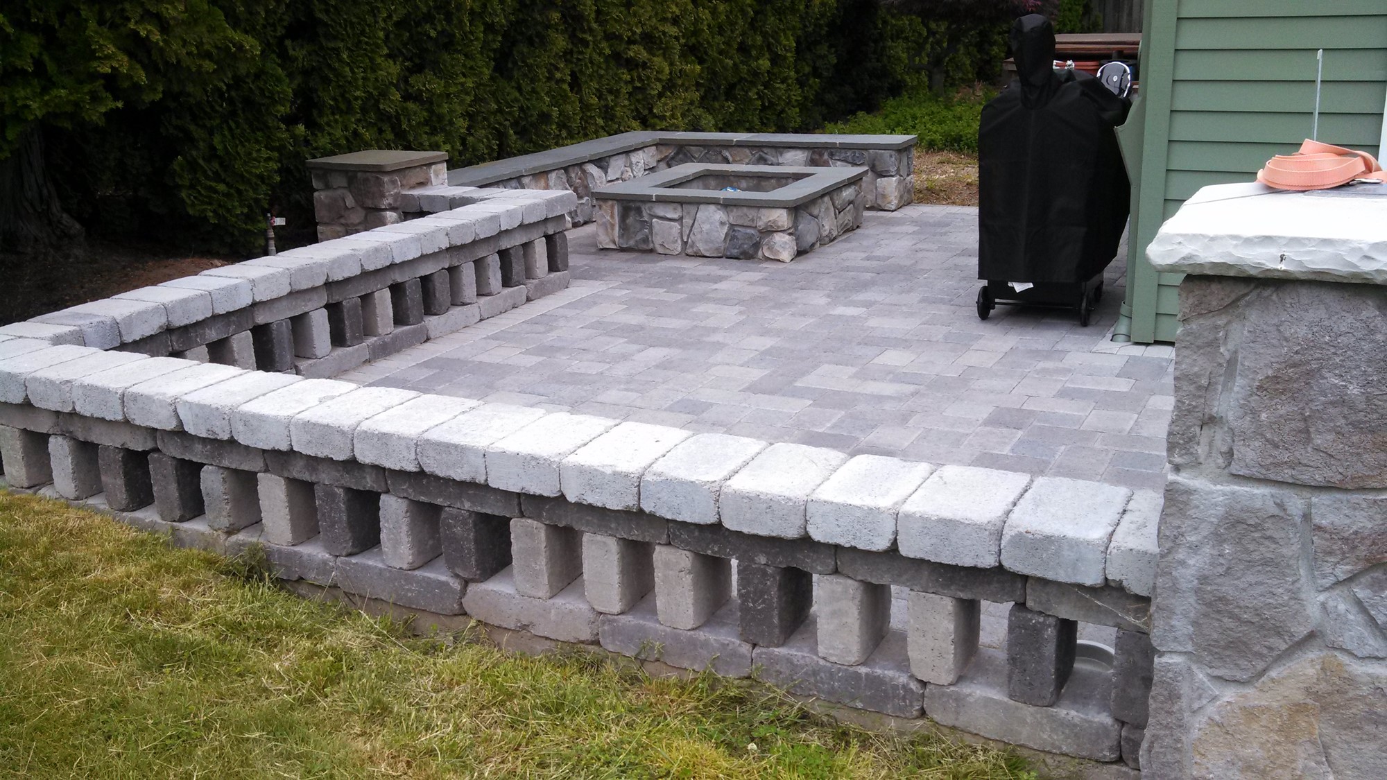 Hradscpe masonry with firepit 